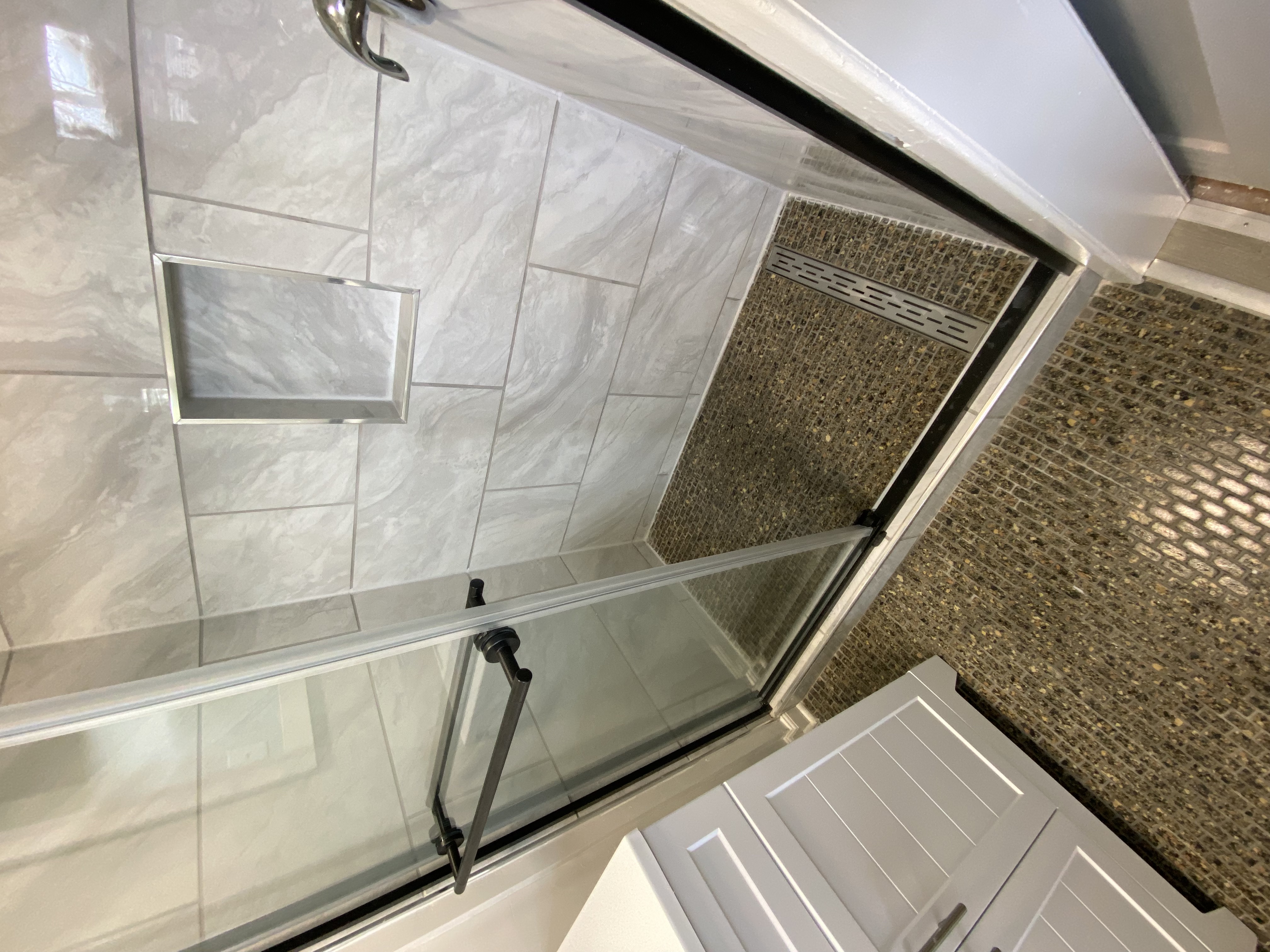 Hall bathroom update with new vanity, LVP flooring, and tub surround